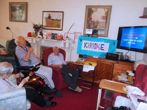 mixed group enjoying karaoke together